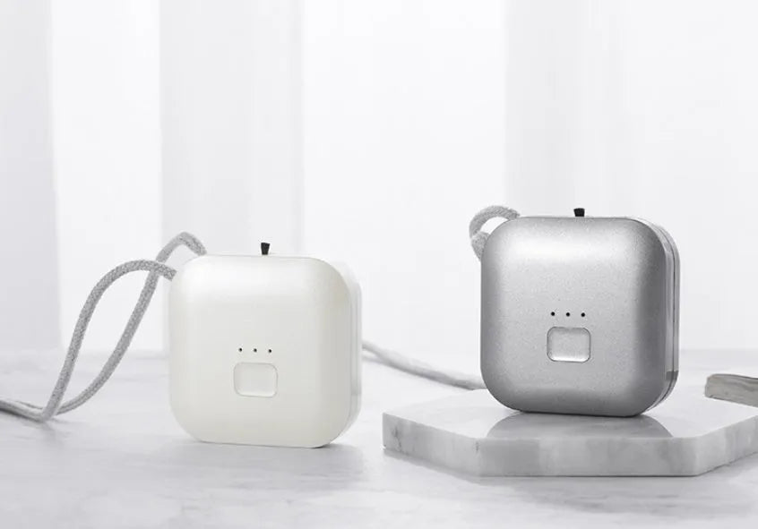 Compact pink USB air purifier necklace with negative ion technology and USB charging port