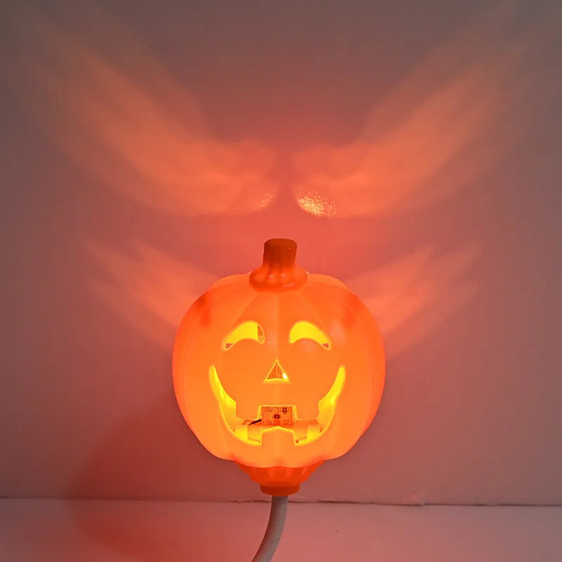 Plastic pumpkin-shaped decorative lamp with USB charging port, showing yellow or purple light option.