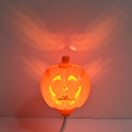 Plastic pumpkin-shaped decorative lamp with USB charging port, showing yellow or purple light option.