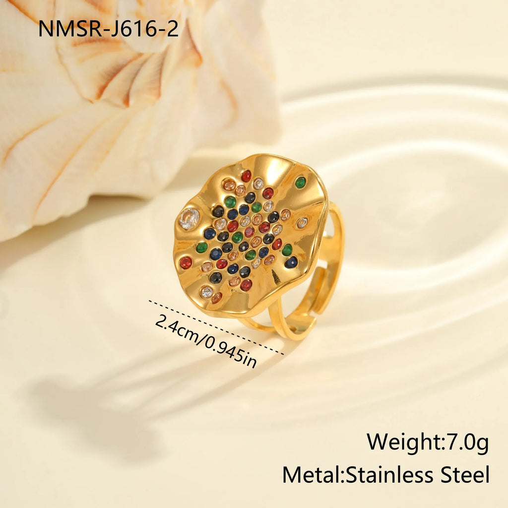 Adjustable geometry ring with pleated diamond pattern on stainless steel