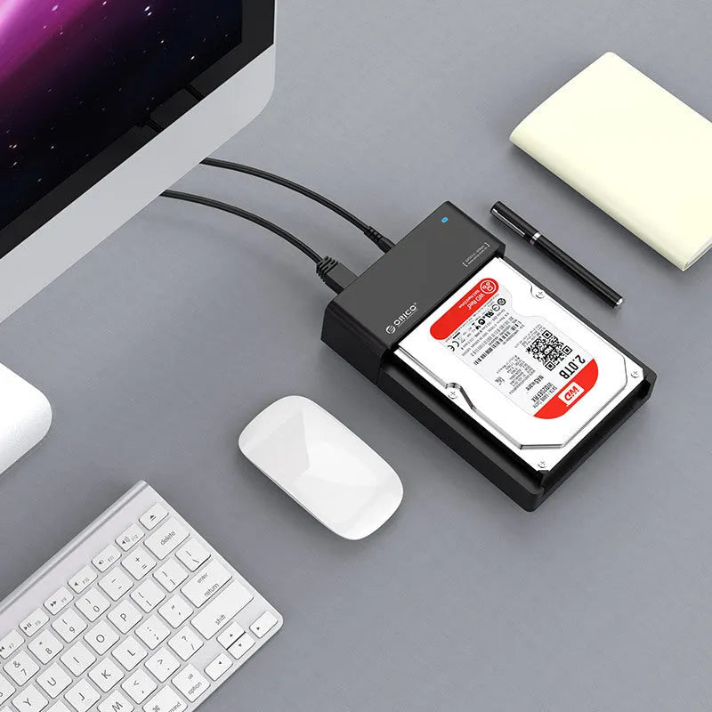 Black plastic external hard drive enclosure for 2.5 and 3.5 inch SATA drives with included data cable