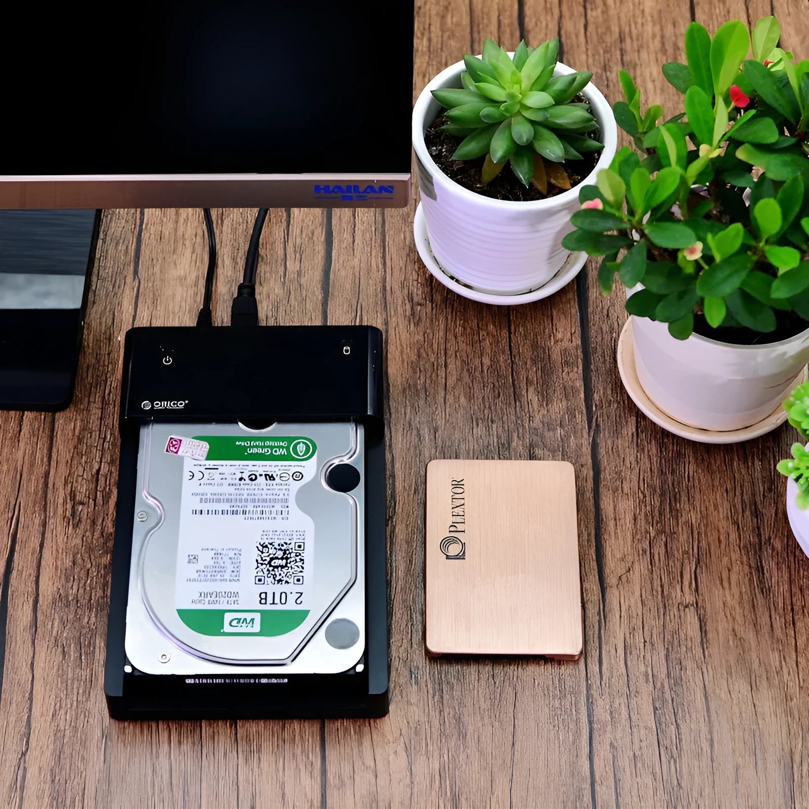 Black plastic external hard drive enclosure for 2.5 and 3.5 inch SATA drives with included data cable