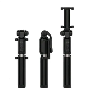 Black Bluetooth selfie stick tripod with remote control extended, holding a smartphone