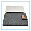 Felt laptop bag in khaki colour showing clamshell design with woven texture exterior