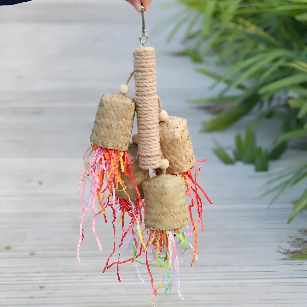 Wood and sisal parrot toy with shredded paper, measuring 15 by 35 centimetres