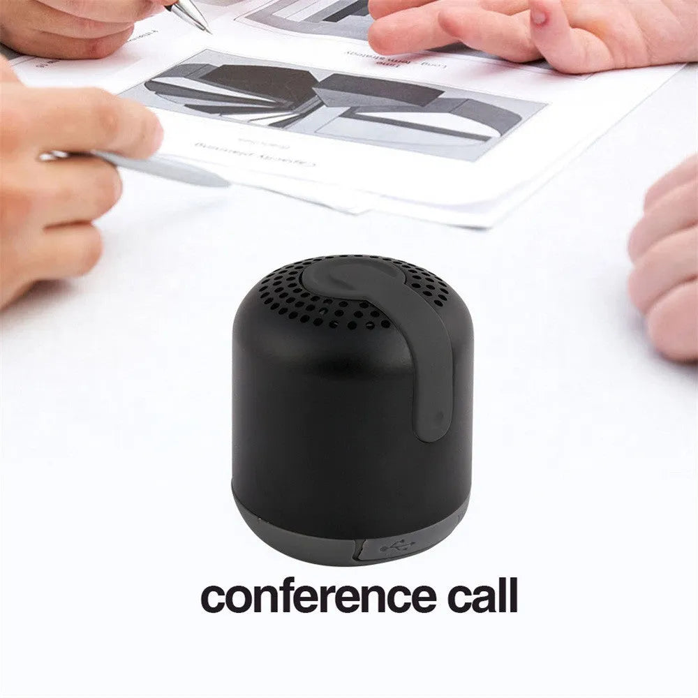 Hieha XQ11 cylindrical mini Bluetooth speaker in silver metal finish, showing compact size.