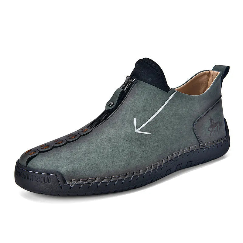 Men's black casual zip-up Martin boots with round toe and low heel on a white background.
