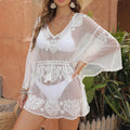 White water-soluble polyester beach blouse for swimming and sun protection.