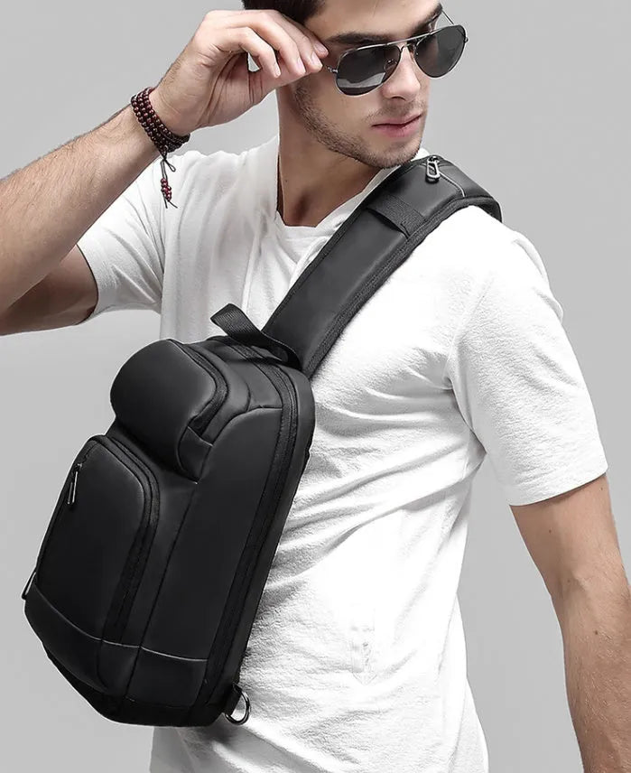 Black medium capacity outdoor shoulder bag with air cushion strap and multiple compartments