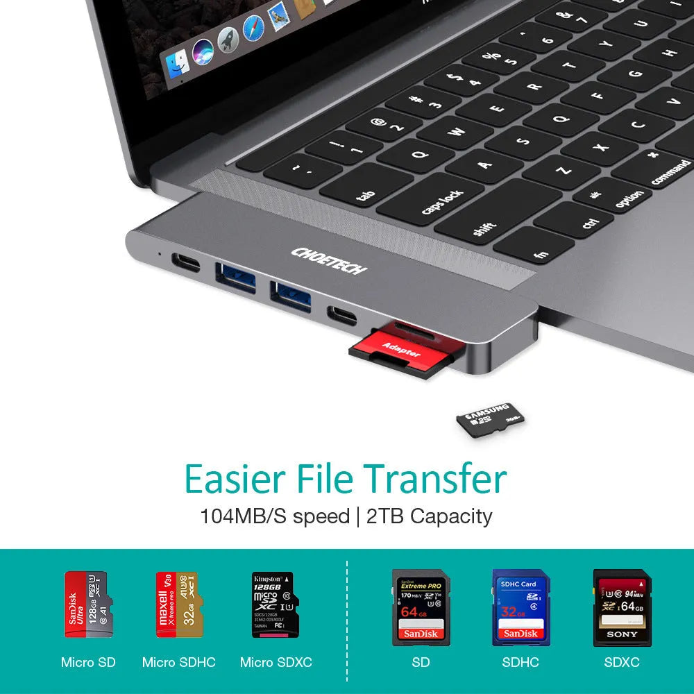 Silver aluminium USB-C 7-in-1 hub adapter with SD card, Micro SD, HDMI, USB 3.0, and Power Delivery ports.