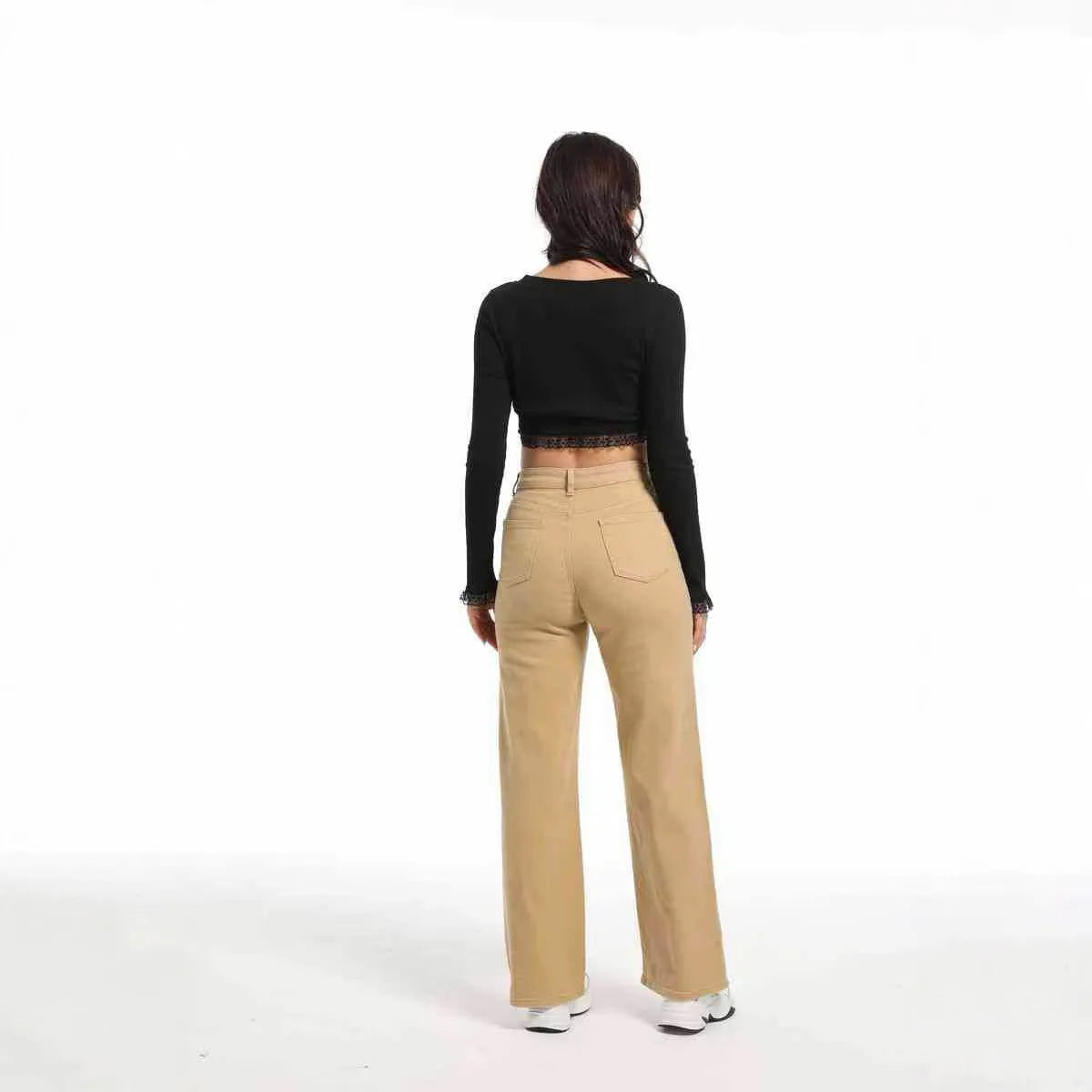 Women's high waist wide leg jeans in apricot colour on a hanger.