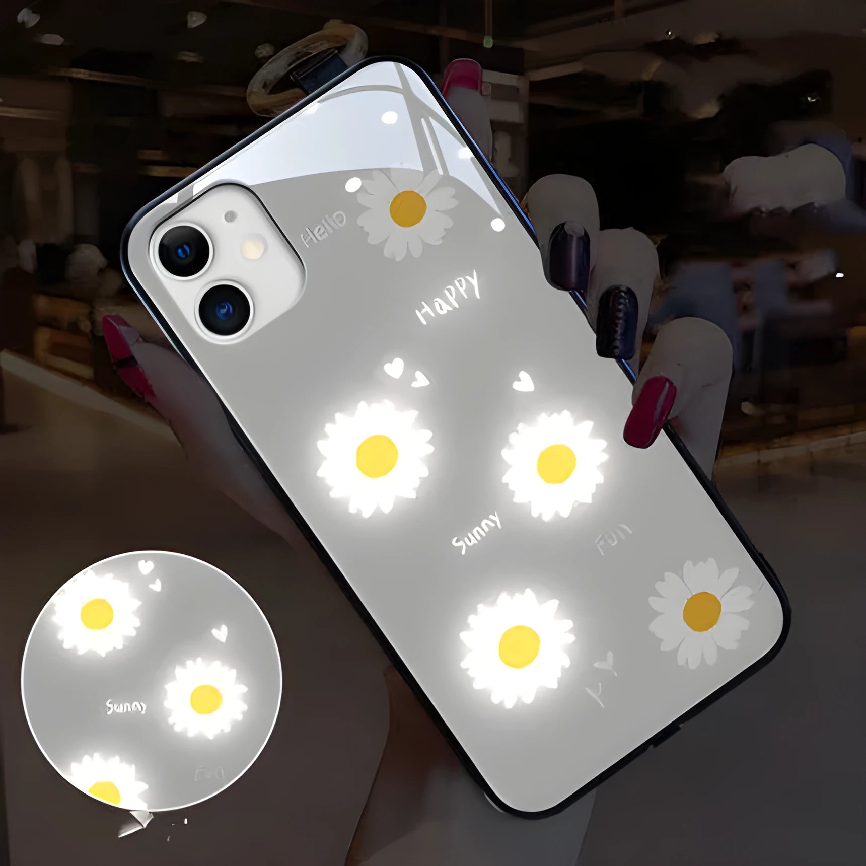 White Apple iPhone case with painted daisy pattern and illuminated voice-activated colour light on display.