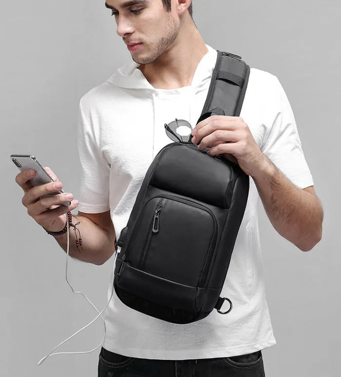 Black medium capacity outdoor shoulder bag with air cushion strap and multiple compartments
