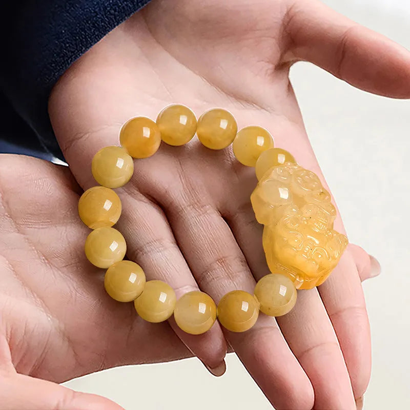 Golden thread Jinsi jade money bracelet with carved beads, shown in large and small size options.