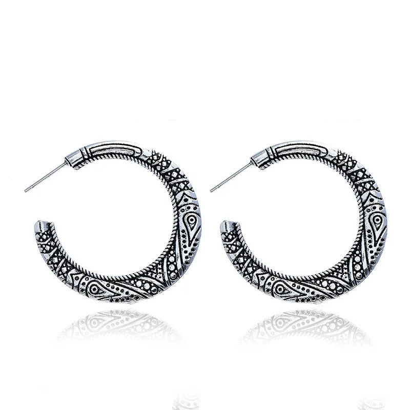 Bronze coloured C-shaped alloy earrings with vintage engraving pattern detail