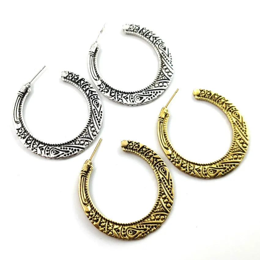 Bronze coloured C-shaped alloy earrings with vintage engraving pattern detail