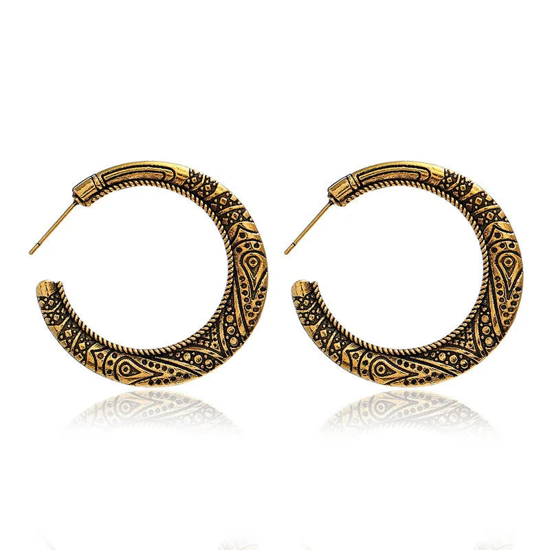 Bronze coloured C-shaped alloy earrings with vintage engraving pattern detail