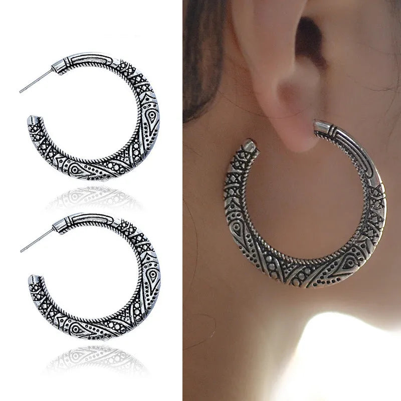 Bronze coloured C-shaped alloy earrings with vintage engraving pattern detail