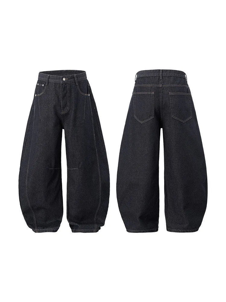 Men's wide leg denim trousers in original cow colour, showing mid waist and relaxed fit.