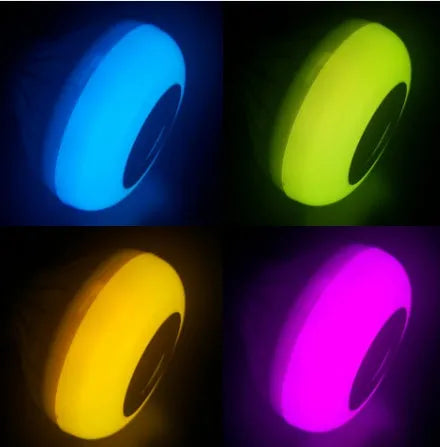 White E27 smart LED bulb with Bluetooth speaker and remote control for wireless light and music adjustment.