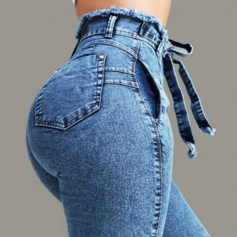 Women's fringed jeans in Cowboy denim, showing fringe detail on leg, available in dark blue, grey, and light blue.