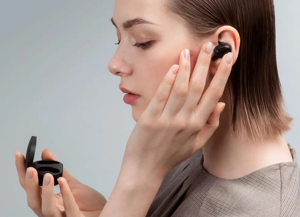 Black Redmi AirDots 2 true wireless earbuds with their compact charging case.