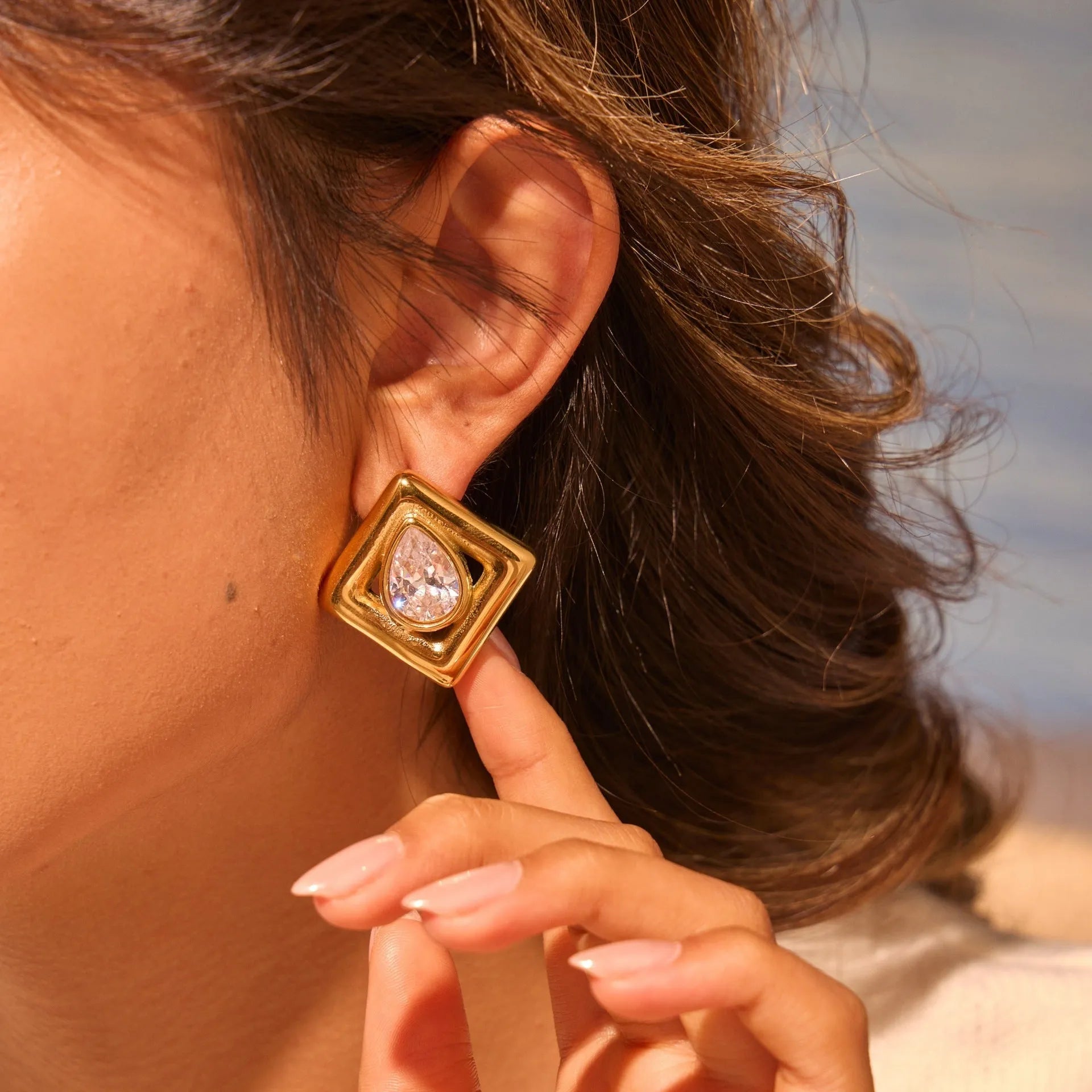 Gold geometric stud earrings with inlaid water drop zircon stones on stainless steel