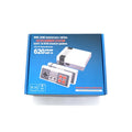 NES 8-bit retro game console with two controllers on dark surface