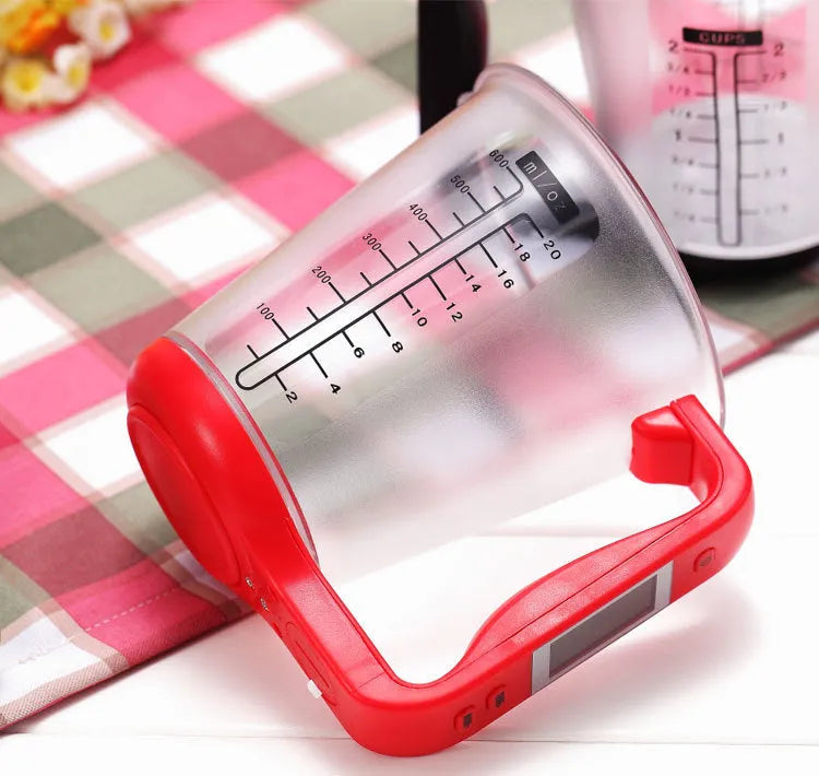 Green digital measuring cup scale with LCD display in handle on white background, 185mm size