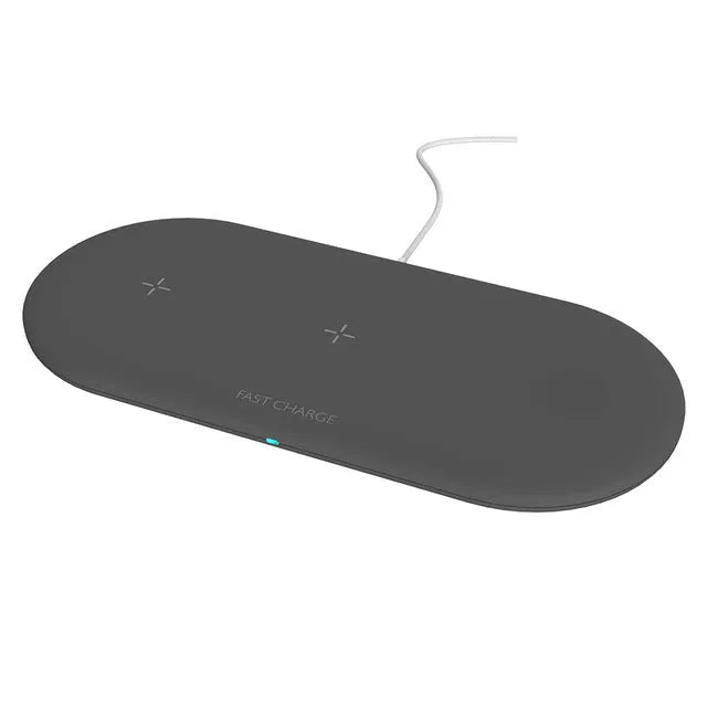 Black and white 3-in-1 wireless charging station for Apple Watch, iPhone and compatible earbuds on a desk.