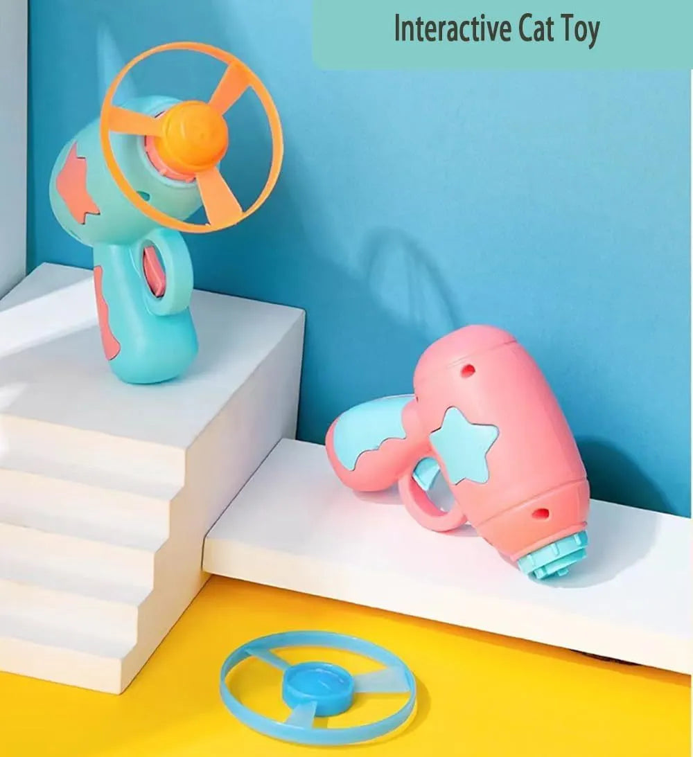 Blue or pink plastic cat toy gun launcher with two coloured frisbees for indoor play.