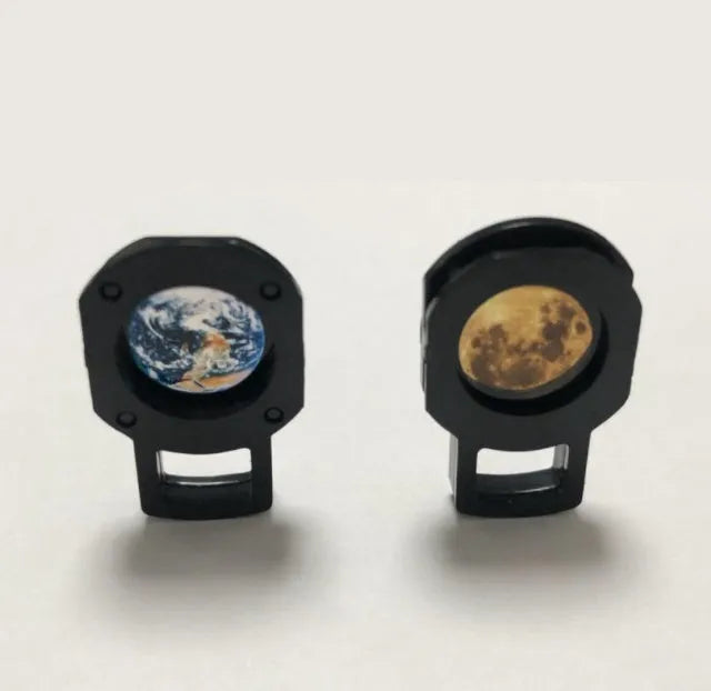 Earth and Moon star projection lamp with adjustable hose bracket on wooden surface