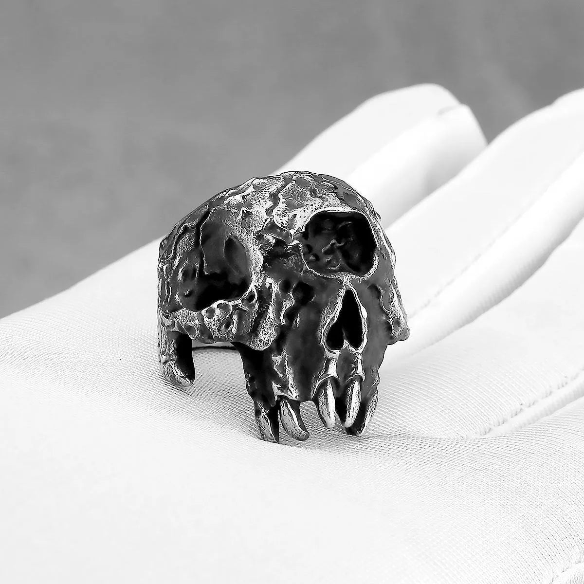 Alloy ring with a one-eyed skull design in a retro hip hop punk style.