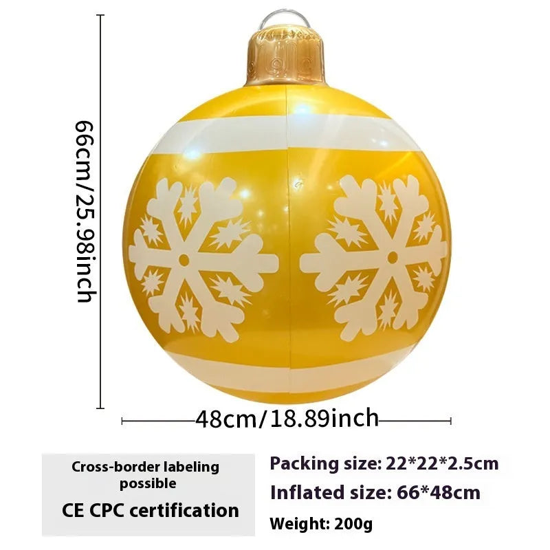 Large red and white inflatable Christmas ball with flashing lights displayed in outdoor garden setting
