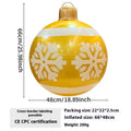 Large red and white inflatable Christmas ball with flashing lights displayed in outdoor garden setting