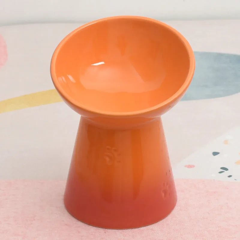 Ceramic anti-tumble pet bowl for dogs and cats with high foot and neck protector.