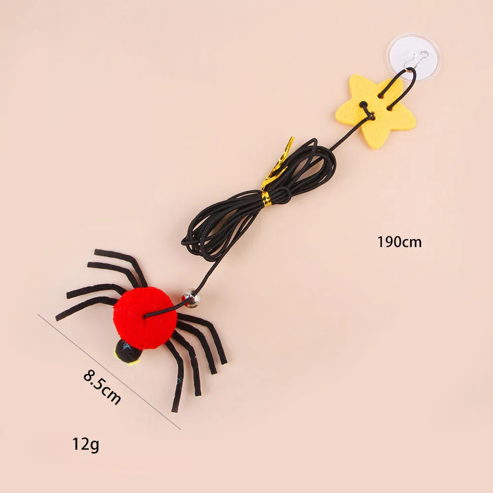 Red and yellow hanging door cat toy with swinging elastic rope, feather, and bell attachments