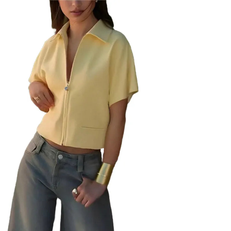 Woman wearing a loose-fitting white damascus-pattern short sleeve polyester casual shirt.