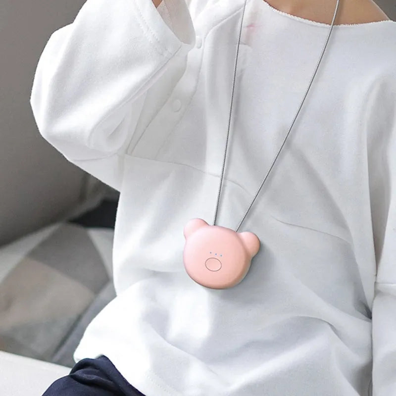 Compact pink USB air purifier necklace with negative ion technology and USB charging port