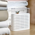 White reusable cabinet dehumidifier box with transparent top showing colour-changing silica gel beads