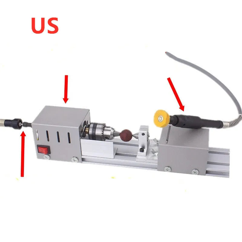 Mini silver metal woodworking lathe with carving knives on benchtop