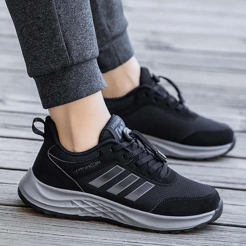 Adult unisex breathable mesh slip-on shoes in black, purple, and dark grey with an elastic band.