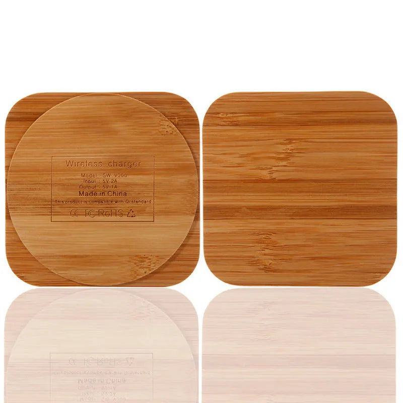 Square brown wooden bamboo wireless charging pad for phones on a desk