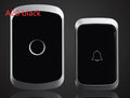 Wireless doorbell kit with plug-in receiver and battery-powered transmitter showing 300m range and 36 melody options