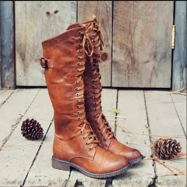 Women's black chunky heel high leg ankle boot with round toe and low rubber sole.