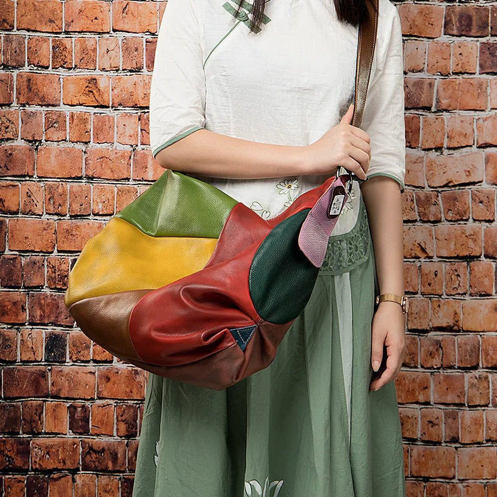 Cowhide leather crossbody shoulder travel bag showing 48cm dimensions with laptop compartment