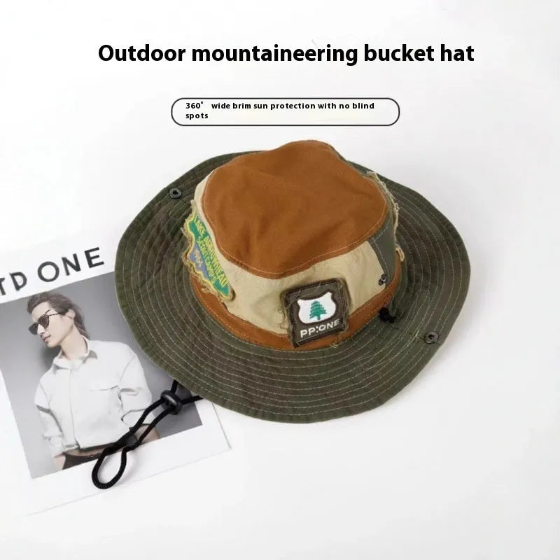 Army green cotton women's fisherman hat with hand-painted patchwork details and a flat top crown.
