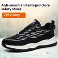 Lightweight orange leather labour protection safety shoe with rubber sole on a work site background.