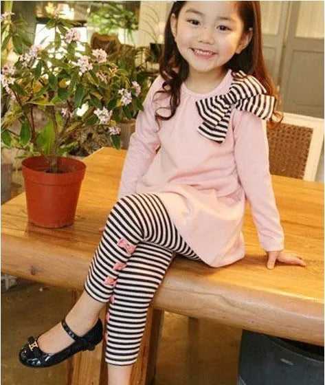 Pink cotton girls clothing set shown in sizes for children 110cm to 140cm tall.