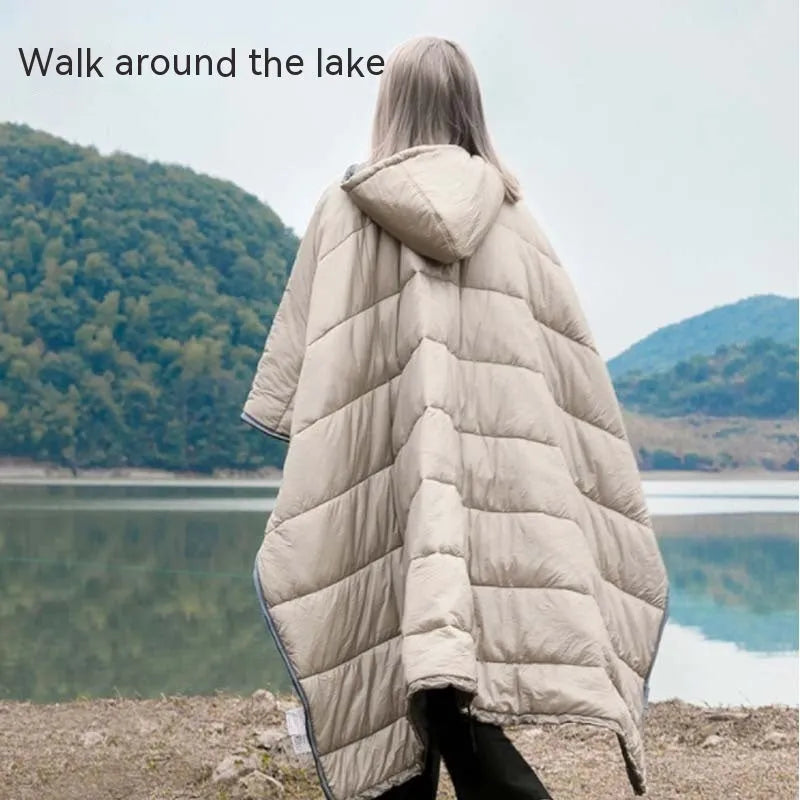 Outdoor cloak sleeping bag shown as wearable cape and flat 200x140cm blanket in army green